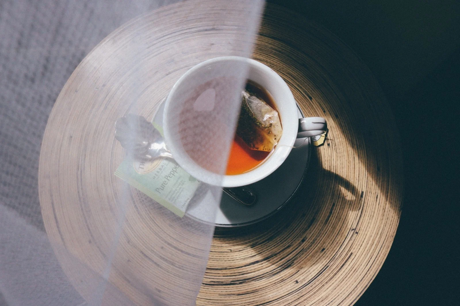 tea in a porcelain glass with vail half over it